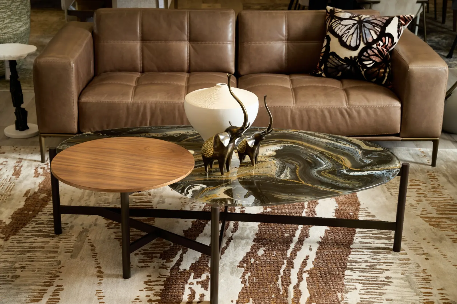 Modern living room furniture display with styled coffee table inside ELEMENT HOME showroom